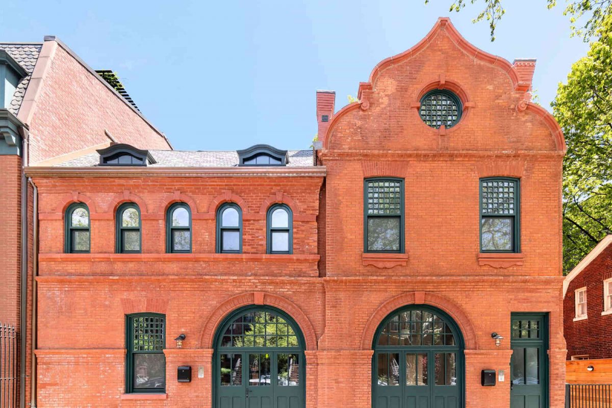 Red brick landmark status building in Brooklyn with wood windows and doors