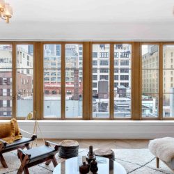 Natural Wood clear stain window in modern interior with industrial view New York